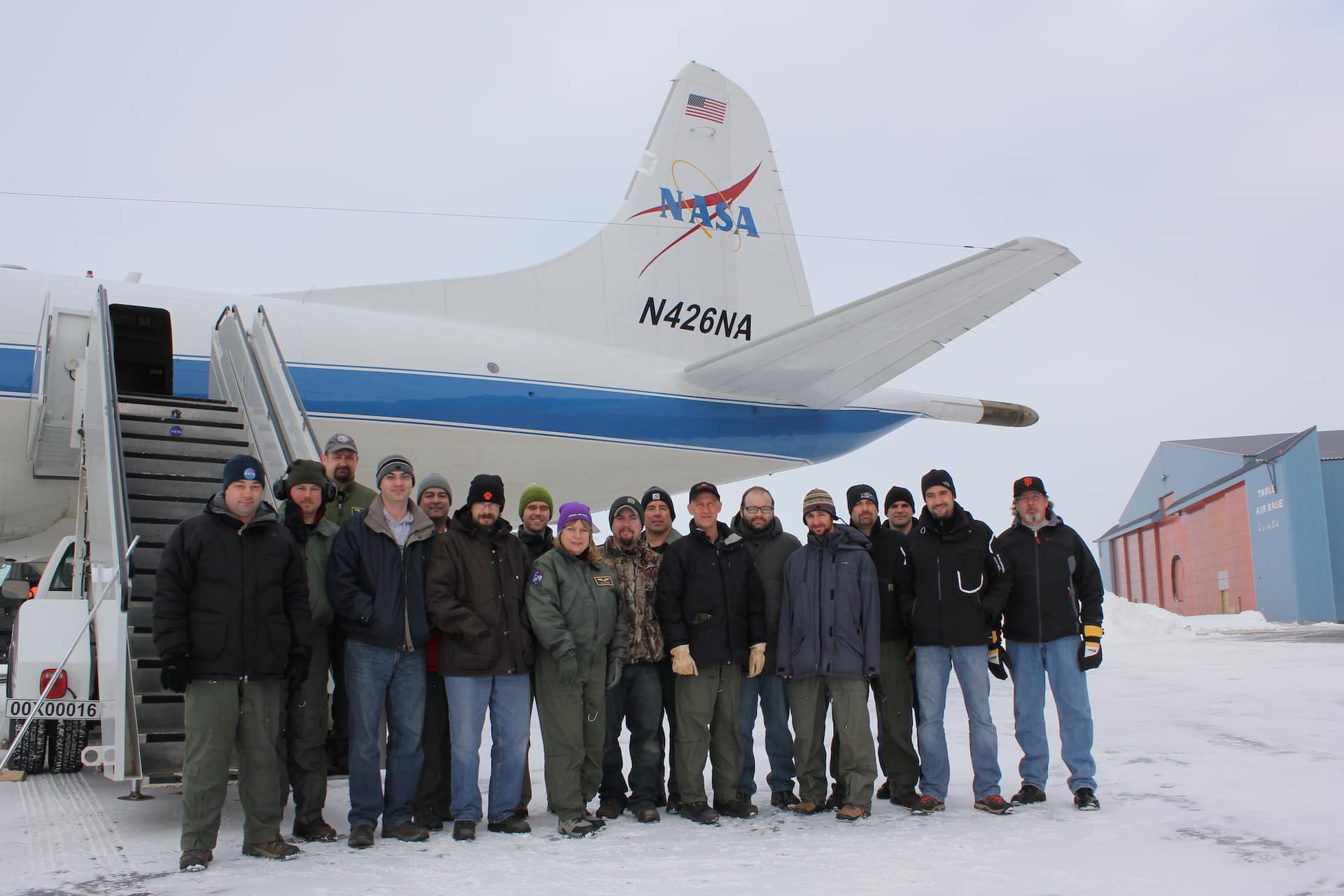 Members of the IceBridge team pose for a group photo in front of the NASA P-3B prior to heading home from Thule Air Base in northern Greenland. Credit: MSgt. Robert Brown / U.S. Air Force NASA's Operation IceBridge is an airborne science mission to study Earth's polar ice. For more information about IceBridge, visit: <a href=" http://www.nasa.gov/icebridge " rel="nofollow">www.nasa.gov/icebridge</a>