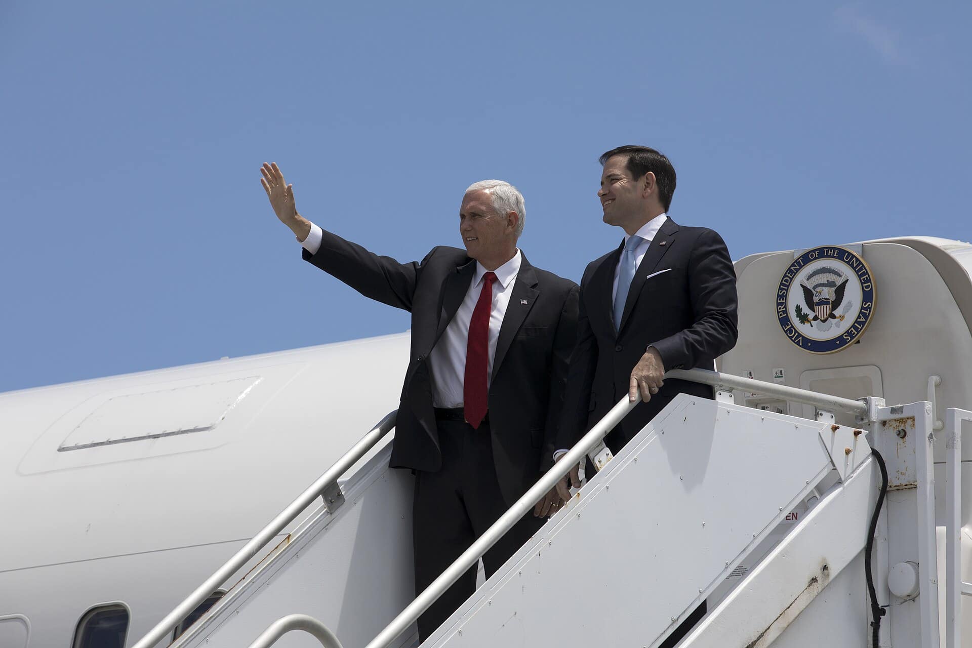Vice President Mike Pence, left, waves as he and Sen. Marco Rubio of Florida arrive aboard Air Force Two at the Shuttle Landing Facility at NASA's Kennedy Space Center in Florida. During his visit to Kennedy, the Vice President spoke inside the iconic Vehicle Assembly Building, where he thanked employees for advancing American leadership in space. Photo credit: NASA/Kim Shiflett NASA image use policy.