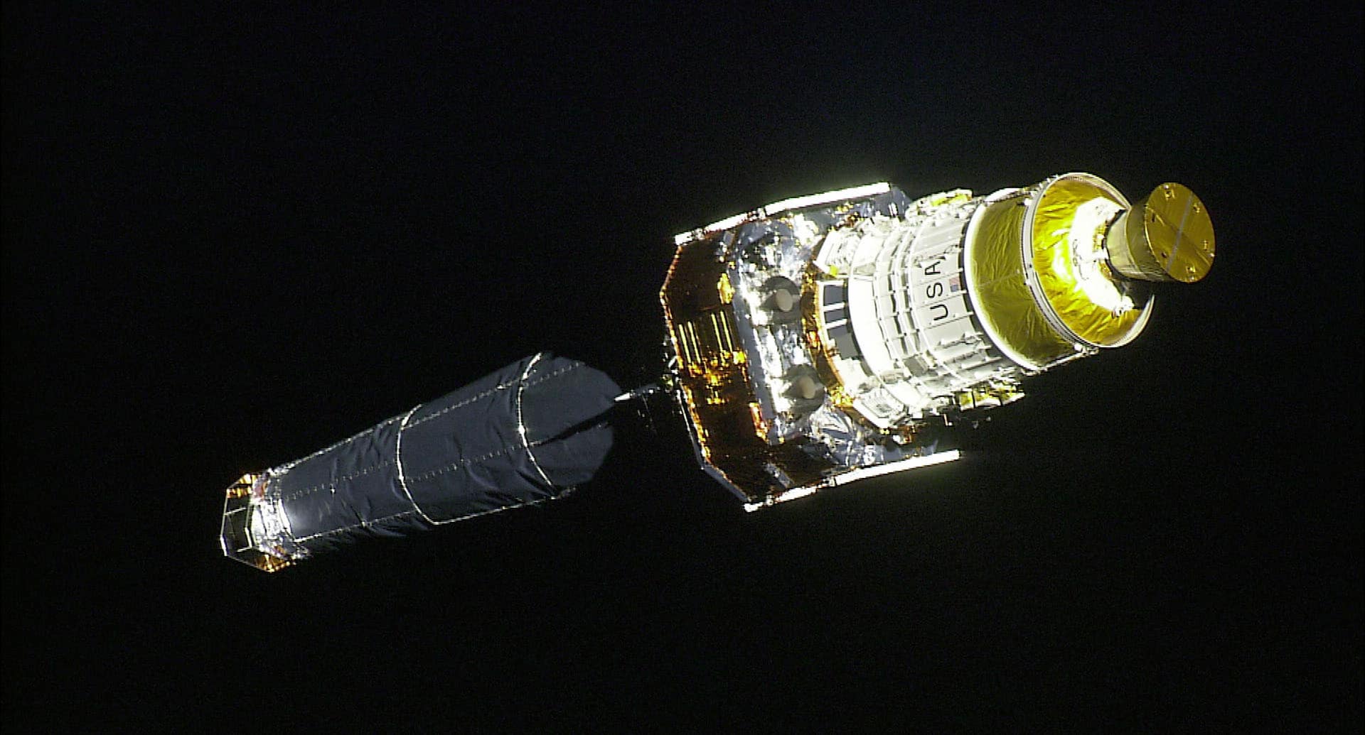 This image of NASA's Chandra X-ray Observatory following deployment from the Space Shuttle Columbia was taken from High Definition Television (HDTV) shot by Columbia Astronaut Mission Specialist Cady Coleman, during the STS-93 mission. Chandra, the world's most powerful x-ray telescope, was developed by NASA's Marshall Space Flight Center in Huntsville, Ala.