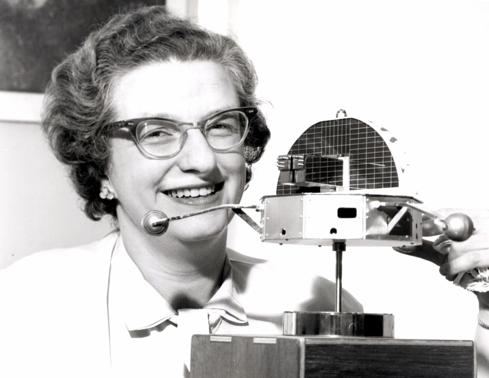 Dr. Nancy Roman, one of the nations top scientists in the space program, is shown with a model of the Orbiting Solar Observatory (OSO). Dr. Nancy Roman received her PhD in astronomy from the University of Chicago in 1949. In 1959, Dr. Roman joined NASA and in 1960 served as Chief of the Astronomy and Relativity Programs in the Office of Space Science. She was very influential in creating satellites such as the Cosmic Background Explorer (COBE) and the Hubble Space Telescope (HST). She retired from NASA in 1979, but continued working as a contractor at the Goddard Space Flight Center. Throughout her career, Dr. Roman was a spokesperson and advocate of women in the sciences.